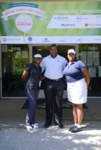 Tonnice Charles (left) and Danni Green (right) of Owens & Minor golf to benefit Excel to Excel- lence, represented by Jonathan Mayo (center).
