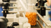 Bottle of pills on a conveyor belt